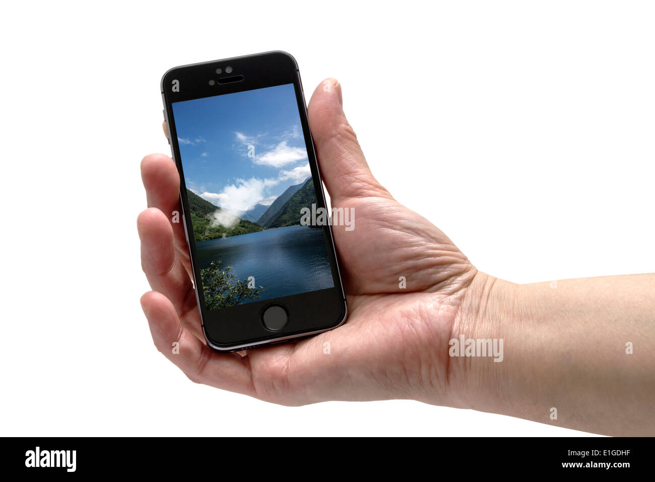 L'IPHONE 5S dans la main isolé sur fond blanc Banque D'Images