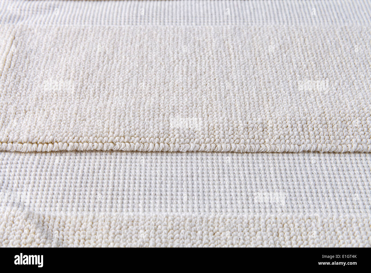 Closeup détail de tapis beige texture background Banque D'Images