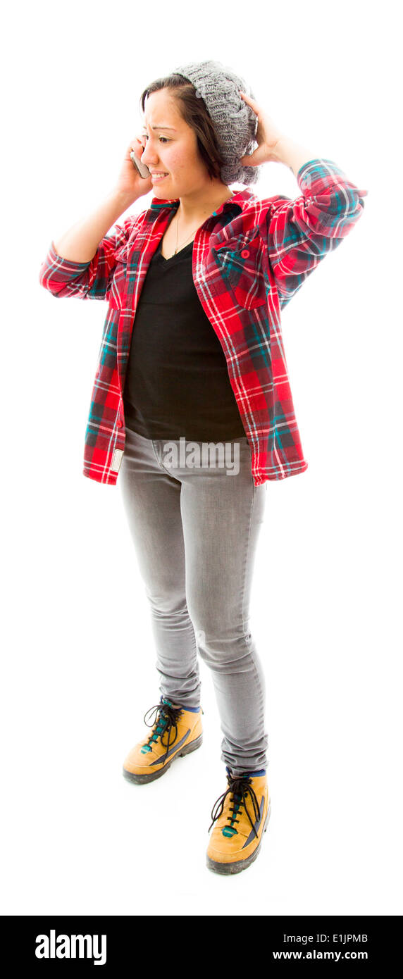 Young Woman talking on mobile phone avec sa main sur sa tête Banque D'Images