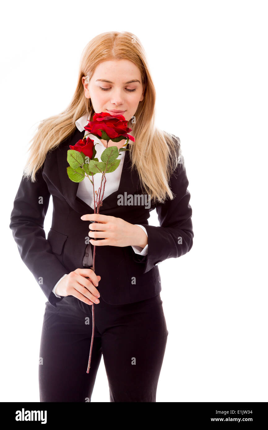 Businesswoman sentir une rose rouge fleur Banque D'Images