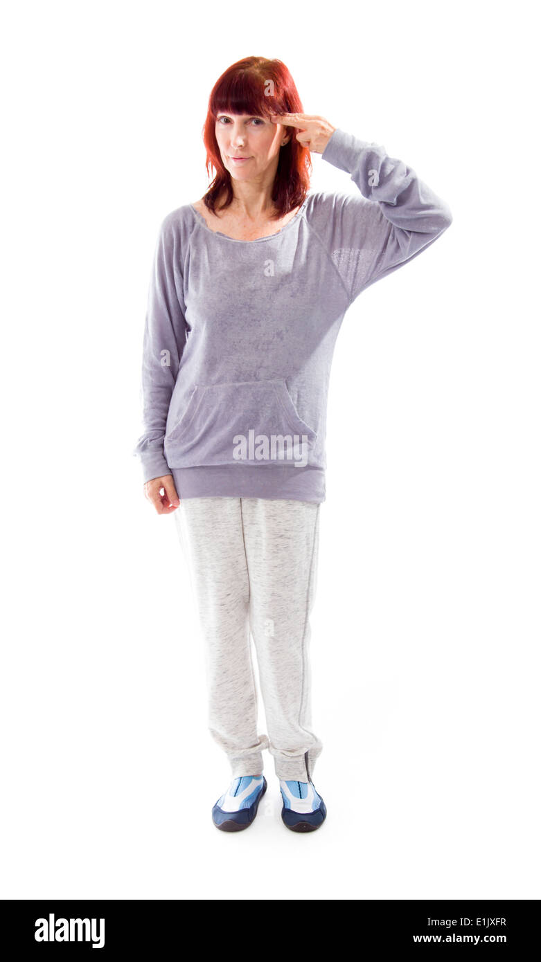 Mature Woman holding son doigt contre sa tête Banque D'Images