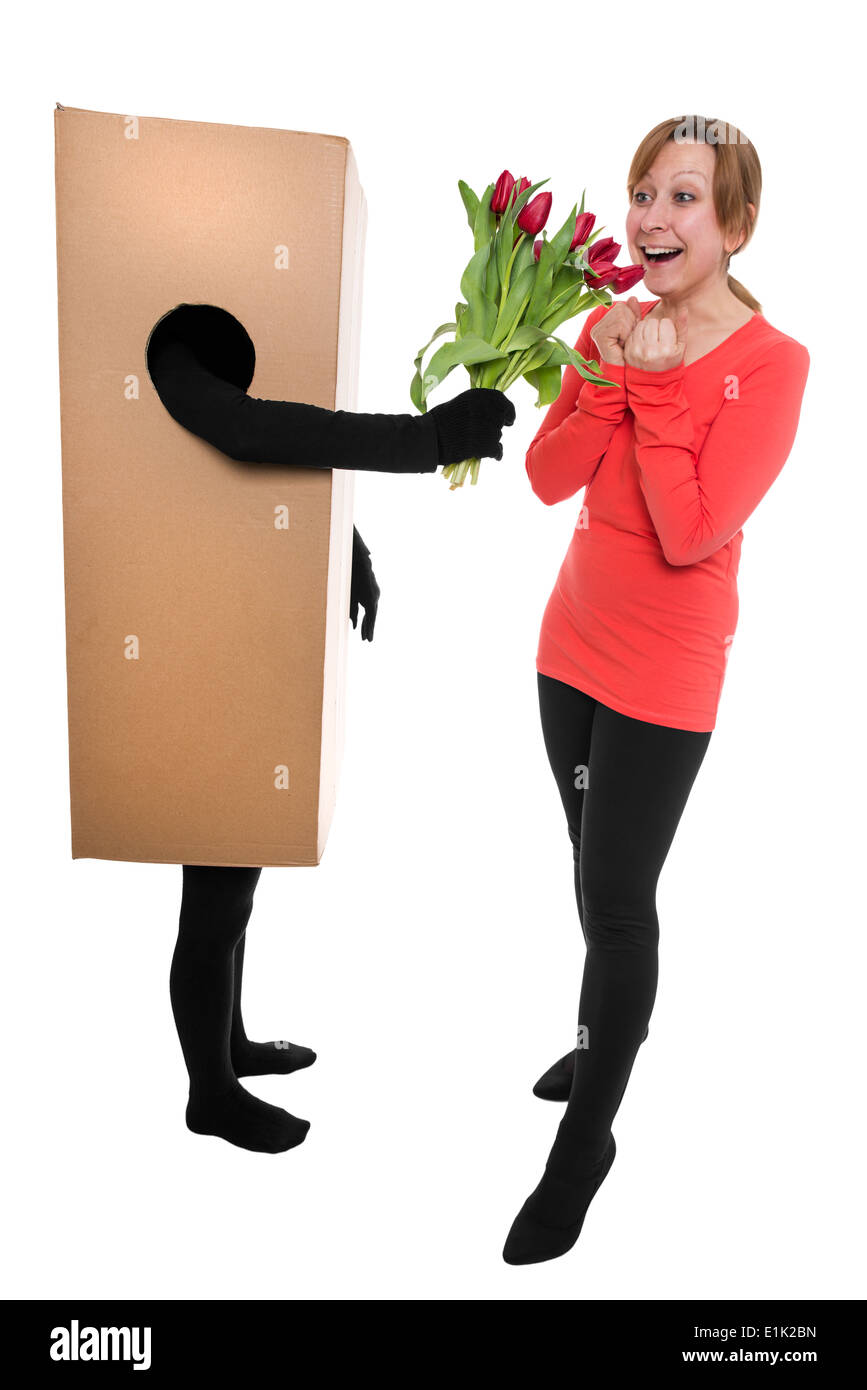 Concept : femme paquet et libérateur avec des fleurs Banque D'Images
