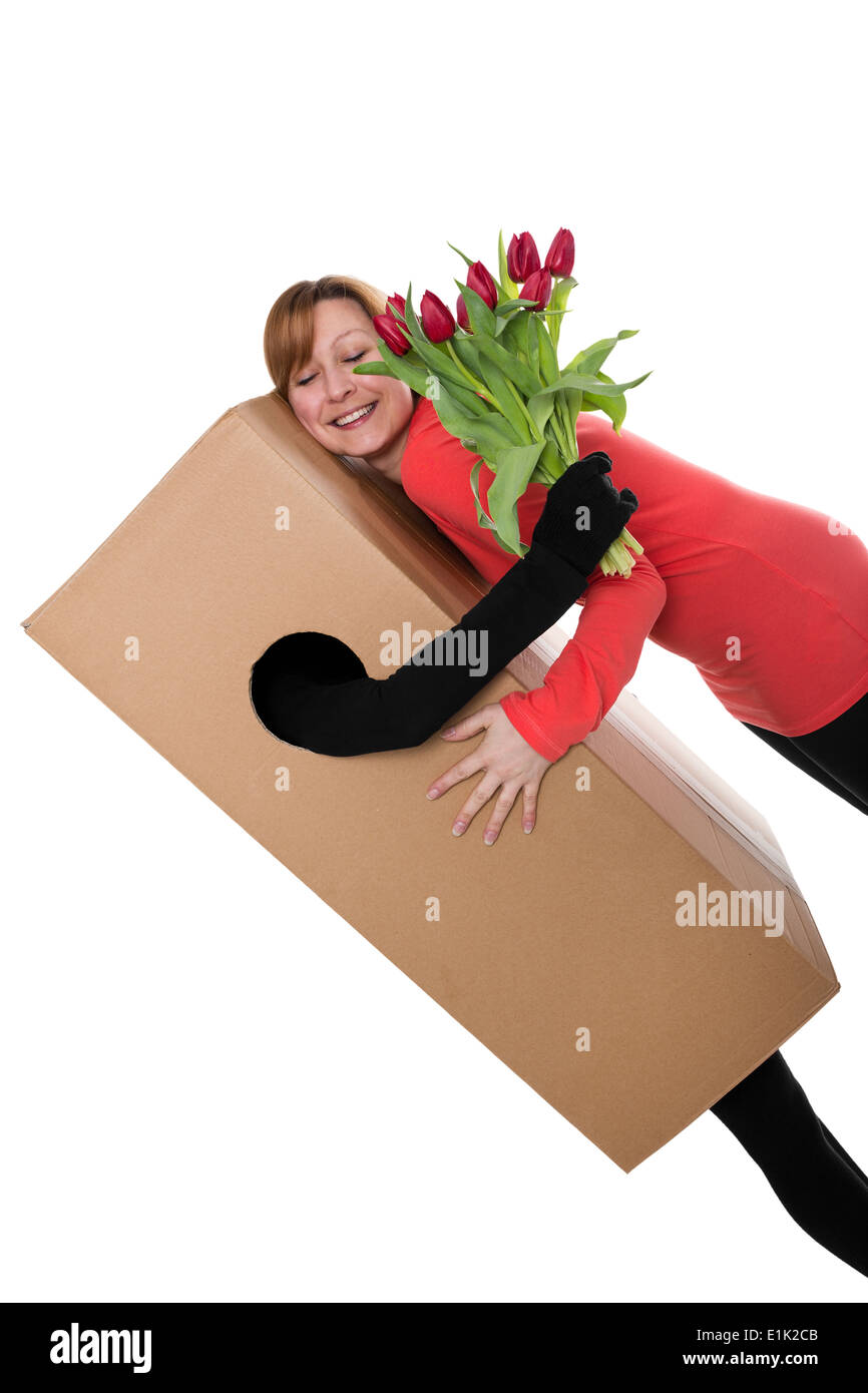 Concept : package libérateur avec des fleurs est une femme serrant Banque D'Images