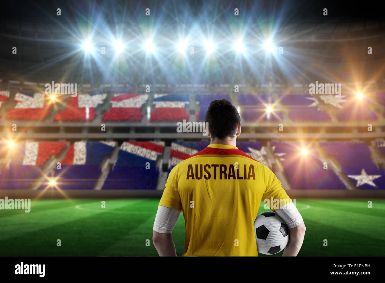 Image composite de l'Australie football player holding ball Banque D'Images