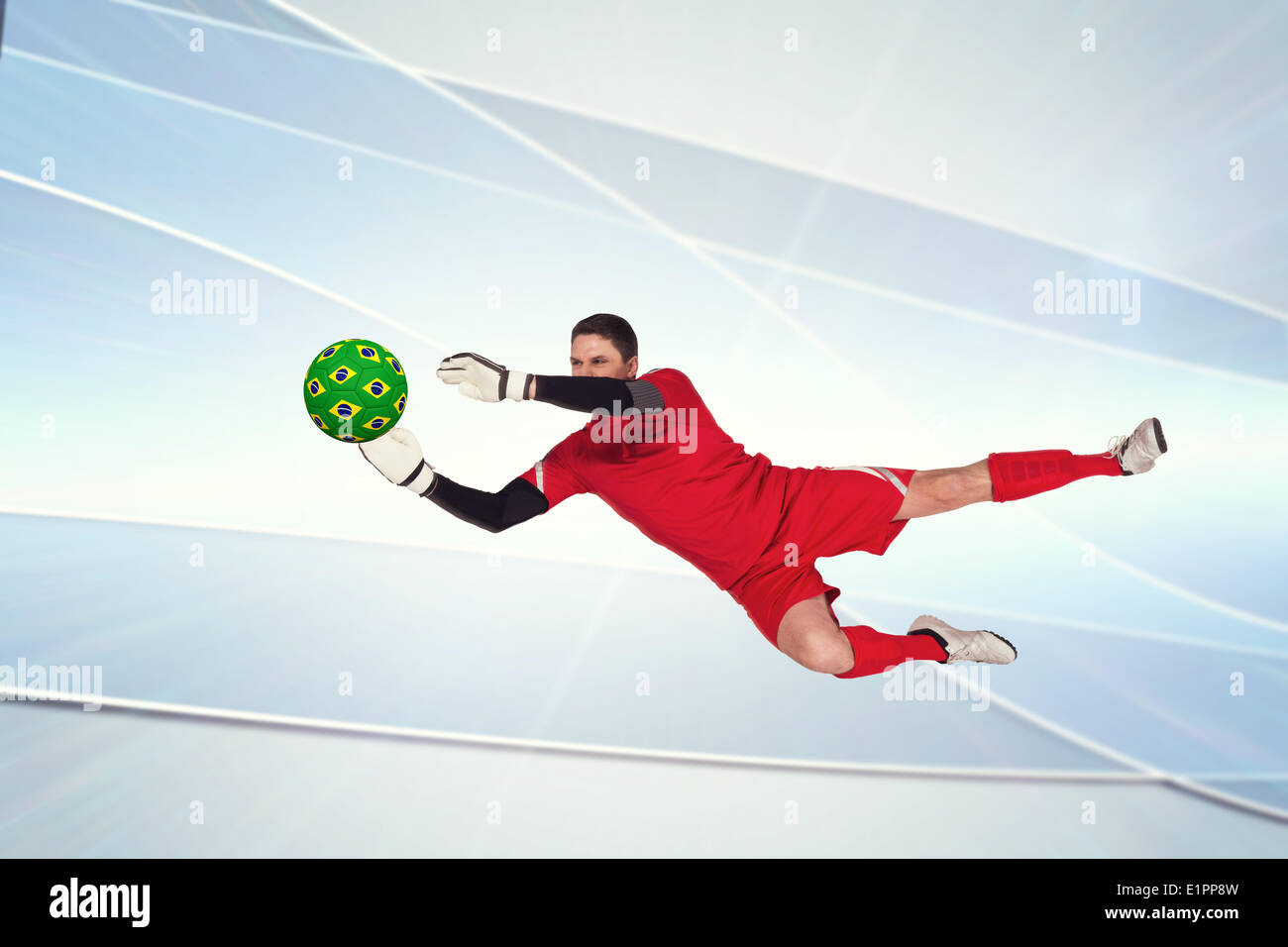 Image composite de la fit sauter de haut gardien de but Banque D'Images Image composite de la fit sauter de haut gardien de but Banque D'Images