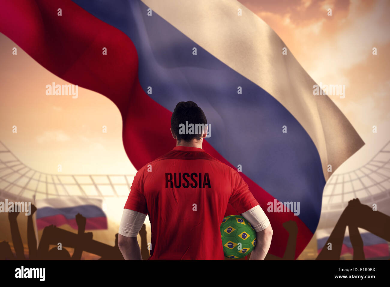 Image composite de la Russie football player holding ball Banque D'Images