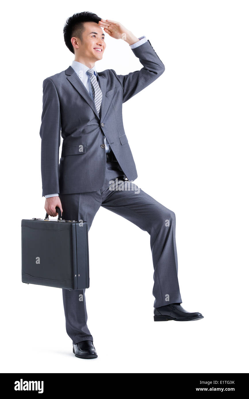 Jeune homme d'affaires à la recherche dans la distance Banque D'Images