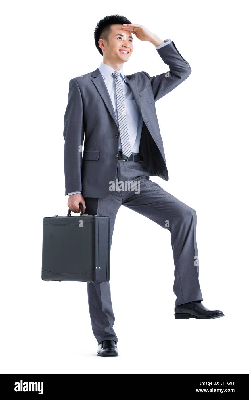 Jeune homme d'affaires à la recherche dans la distance Banque D'Images