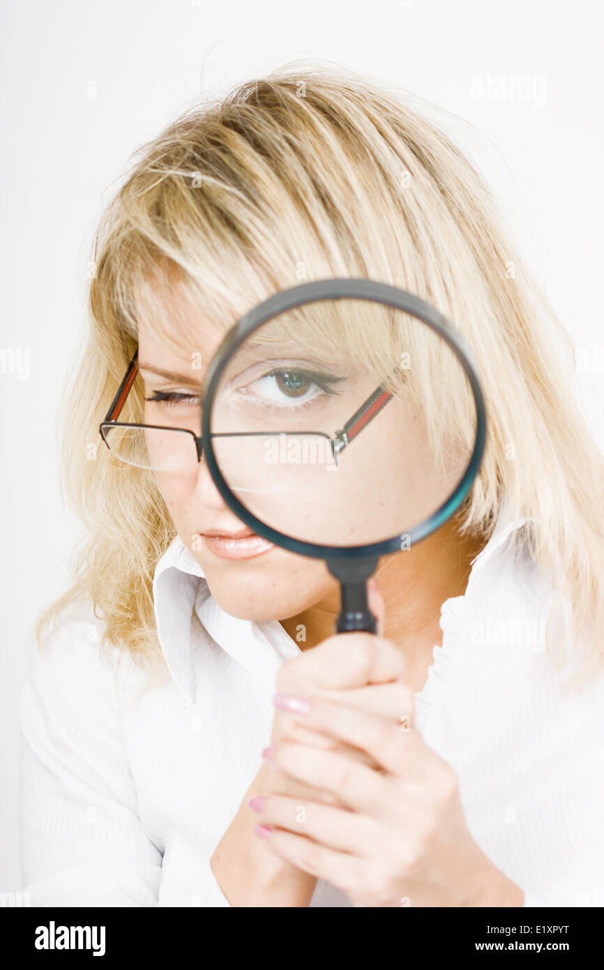 Fille avec une loupe Banque D'Images