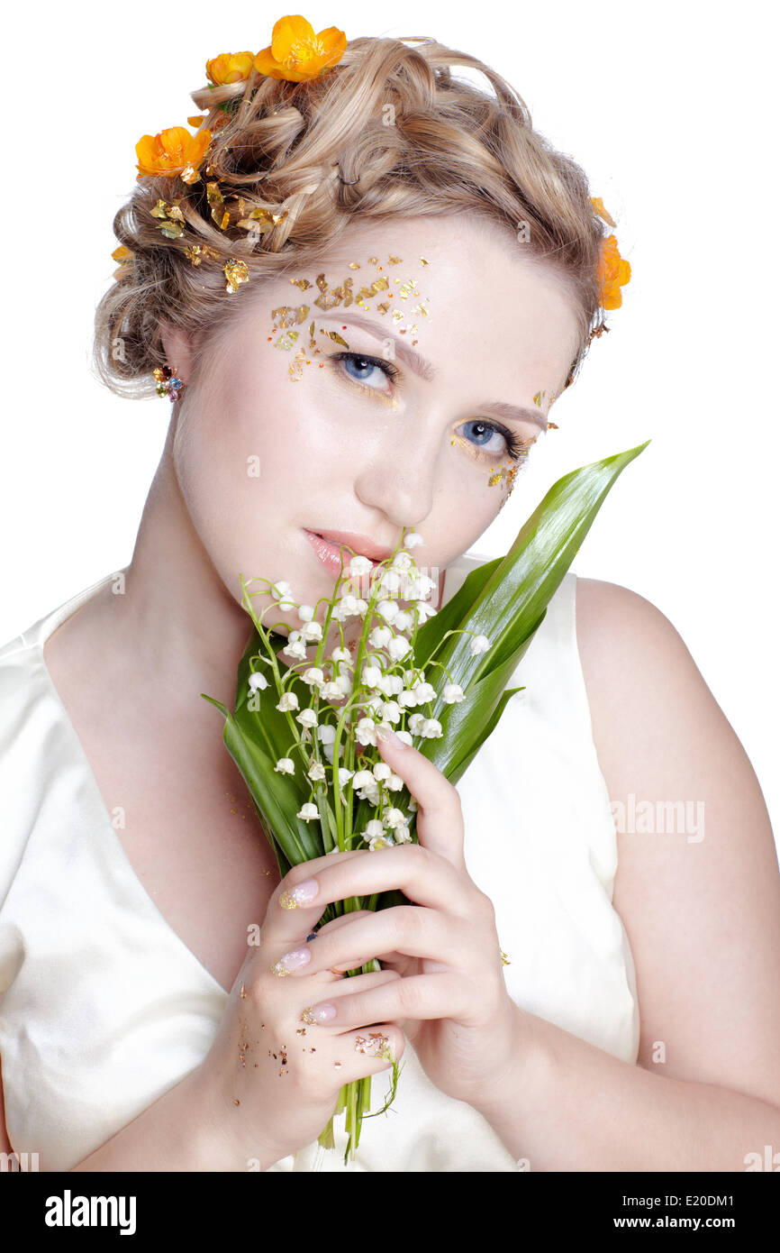 Fille aux fleurs lily mai Banque D'Images