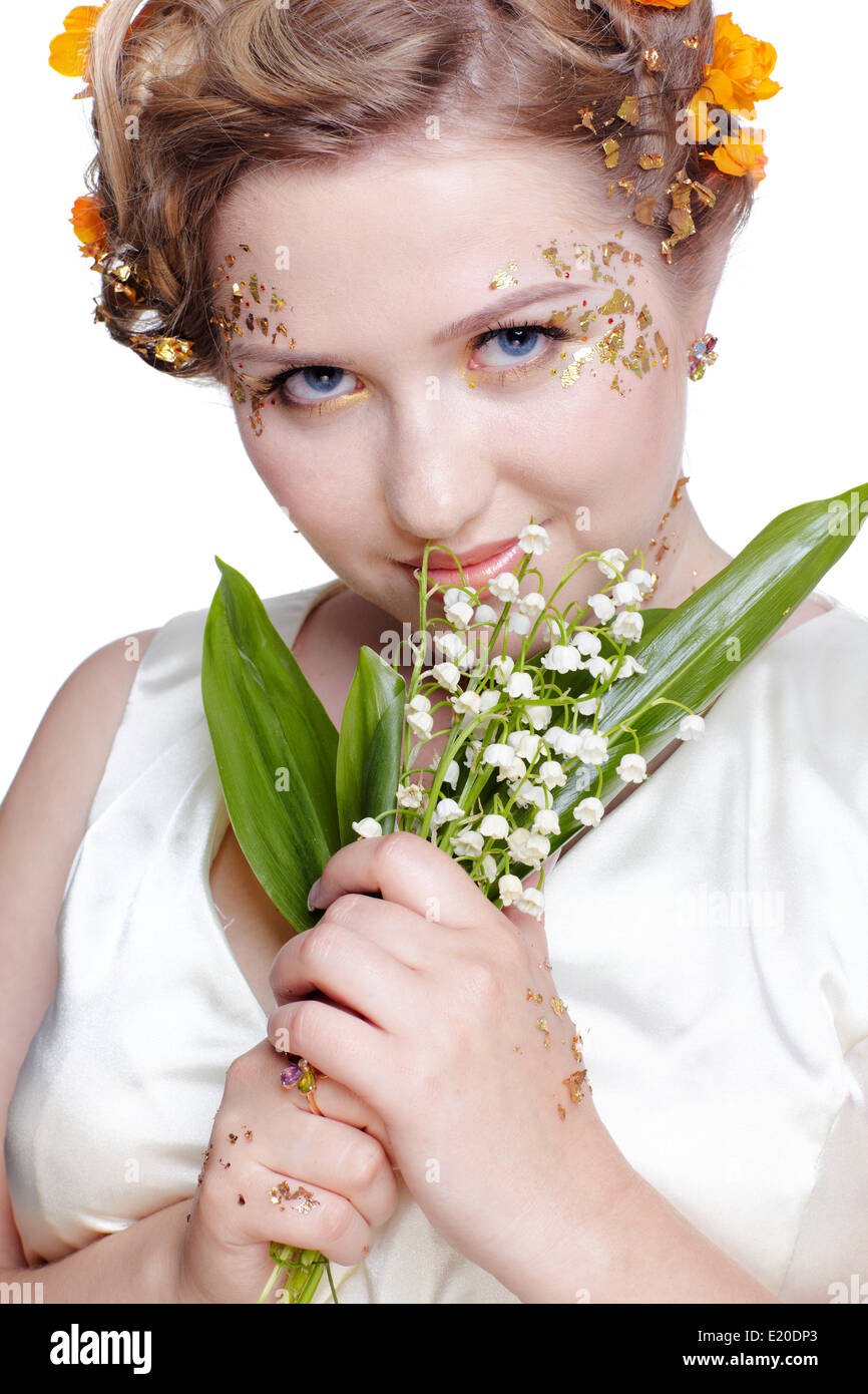 Fille aux fleurs lily mai Banque D'Images