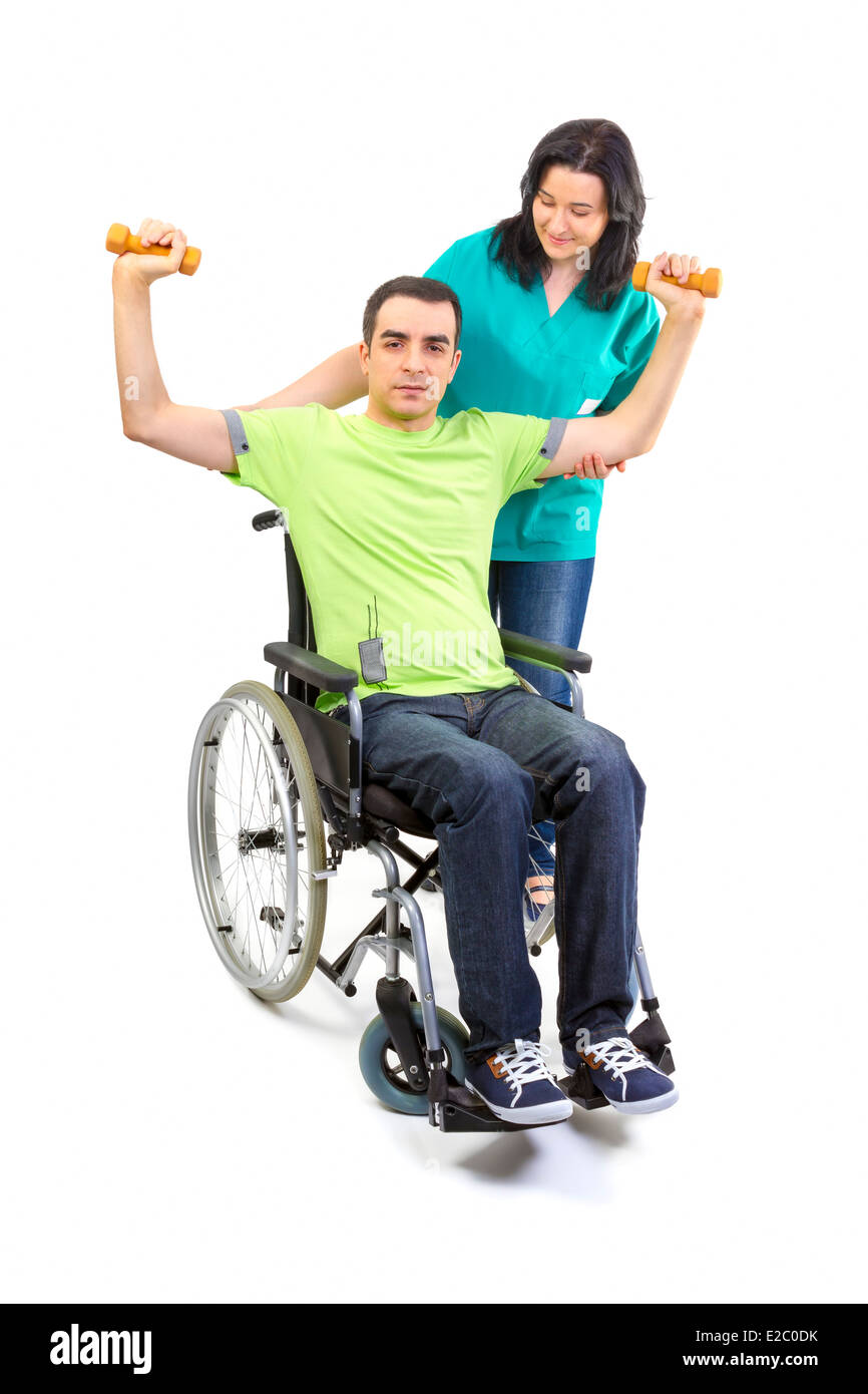 Physiothérapeute travaille avec le patient dans les mains de levage de poids. Les jeunes adultes en fauteuil roulant. Banque D'Images