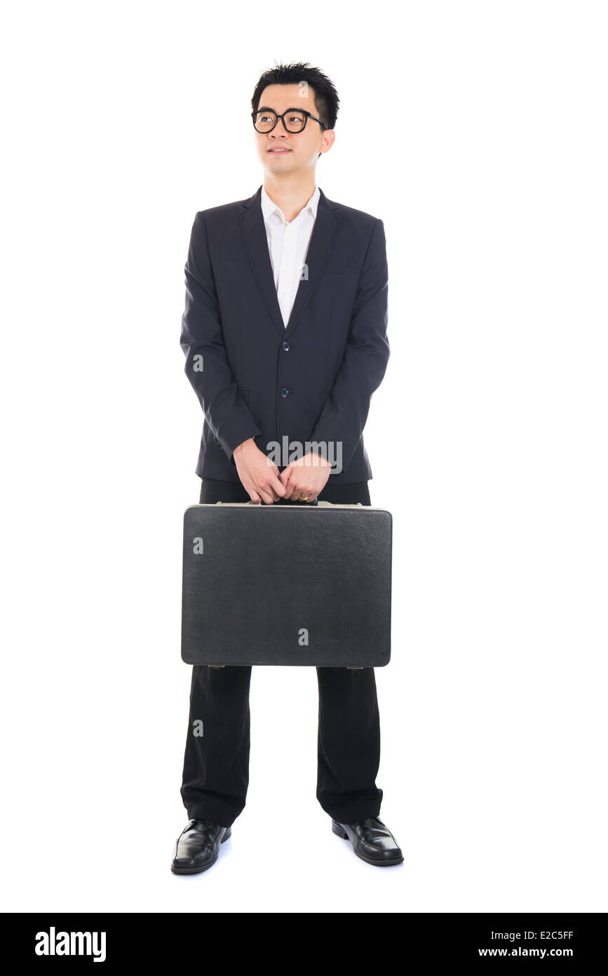 Asian businessman with a suitcase isolated on white Banque D'Images