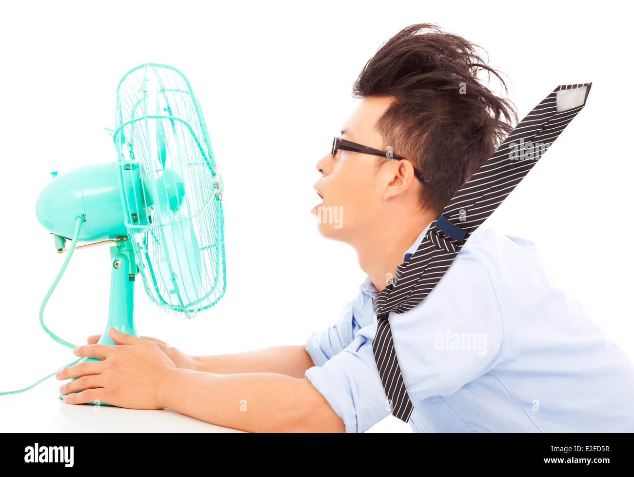 La chaleur de l'homme d'affaires, utilisez des ventilateurs pour refroidir Banque D'Images