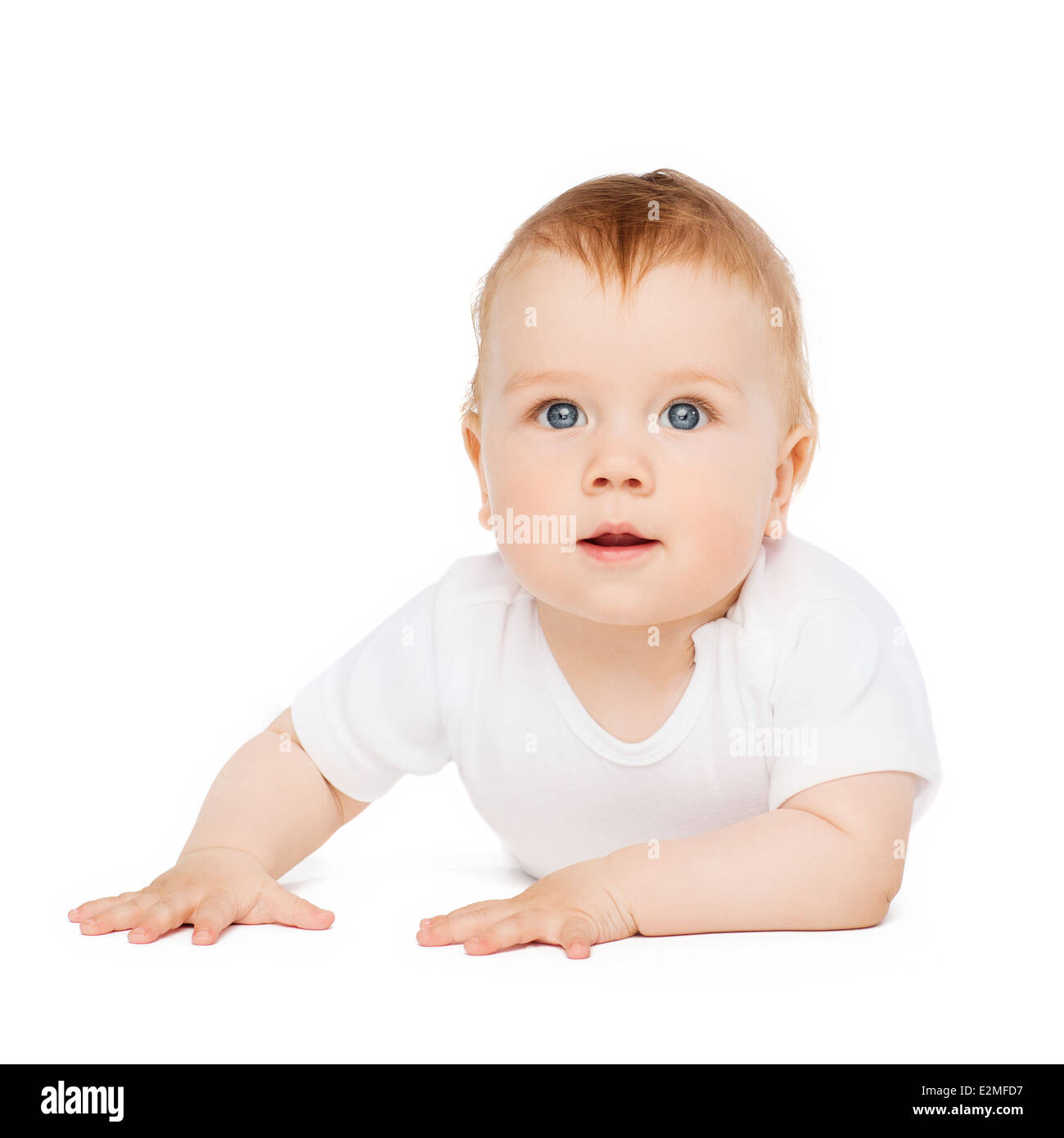 Smiling baby lying on floor and looking up Banque D'Images