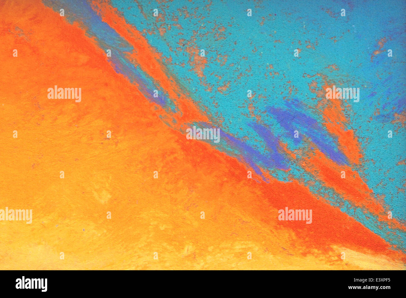 Un mur en stuc peint dans un résumé avec des couleurs vibrantes. Banque D'Images