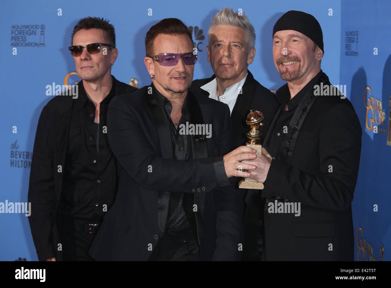 71e Golden Globes Annuel - Salle de presse : Larry Mullen Jr. (l-r), Bono, Adam Clayton et The Edge de U2 où : Los Angeles, United Kingdom Quand : 12 Jan 2014 Banque D'Images