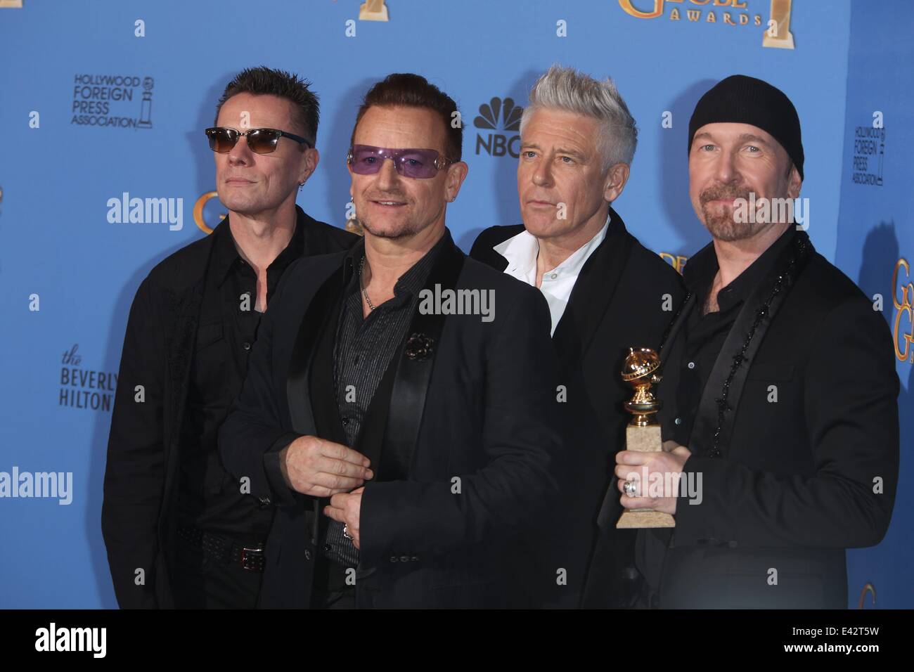 71e Golden Globes Annuel - Salle de presse : Larry Mullen Jr. (l-r), Bono, Adam Clayton et The Edge de U2 où : Los Angeles, United Kingdom Quand : 12 Jan 2014 Banque D'Images