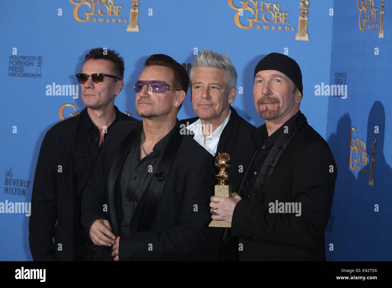 71e Golden Globes Annuel - Salle de presse : Larry Mullen Jr. (l-r), Bono, Adam Clayton et The Edge de U2 où : Los Angeles, United Kingdom Quand : 12 Jan 2014 Banque D'Images