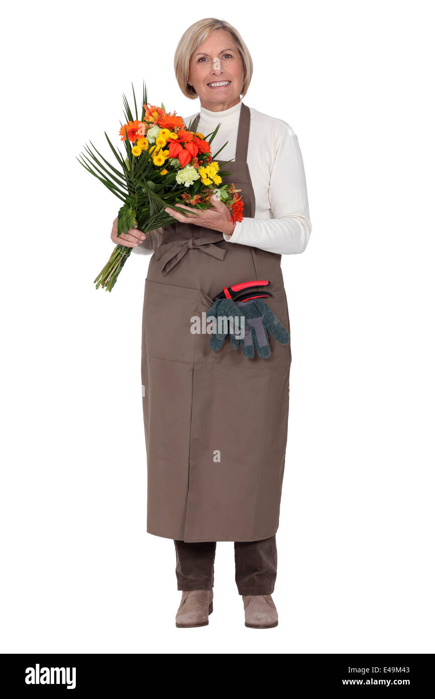 Un fleuriste avec un bouquet de fleurs Banque D'Images