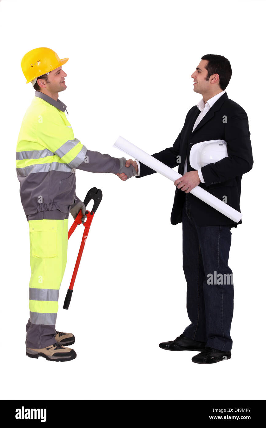 Un ingénieur shaking hands Banque D'Images