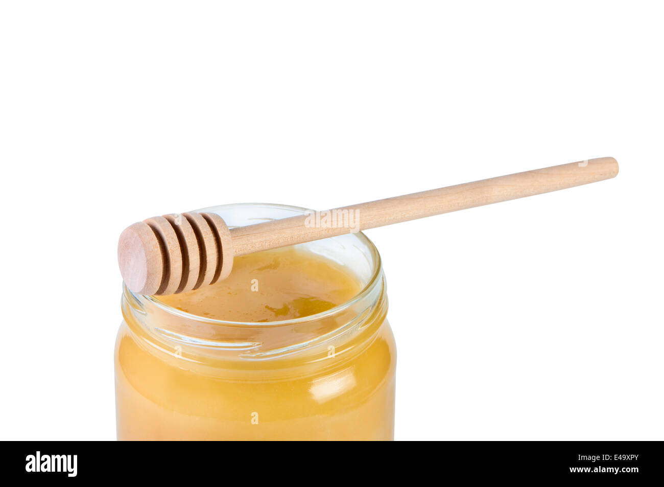 Pot de miel et bâton en bois. Banque D'Images