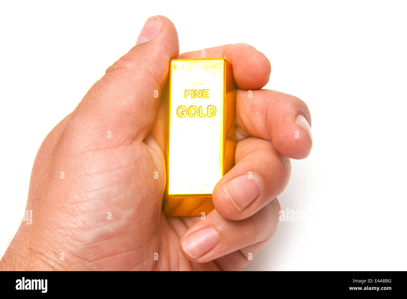 Barre d'or de 200 grammes dans un lingot ou mans hand isolated on a white background studio. Banque D'Images