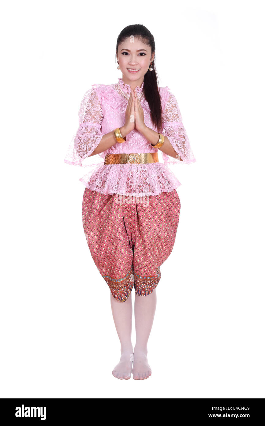 Femme portant robe typiquement thaïlandais payer relativement isolé sur fond blanc, de l'identité de la culture de la Thaïlande Banque D'Images