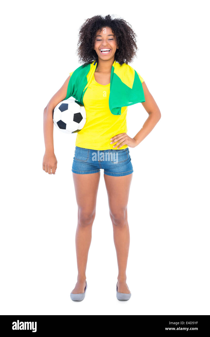Assez fan de football drapeau brésilien holding smiling at camera Banque D'Images