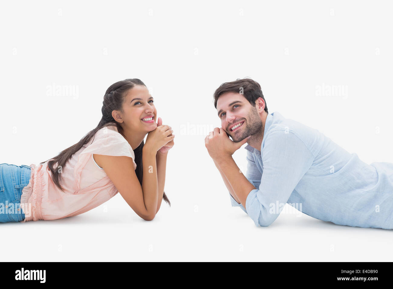 Attractive young couple looking up Banque D'Images
