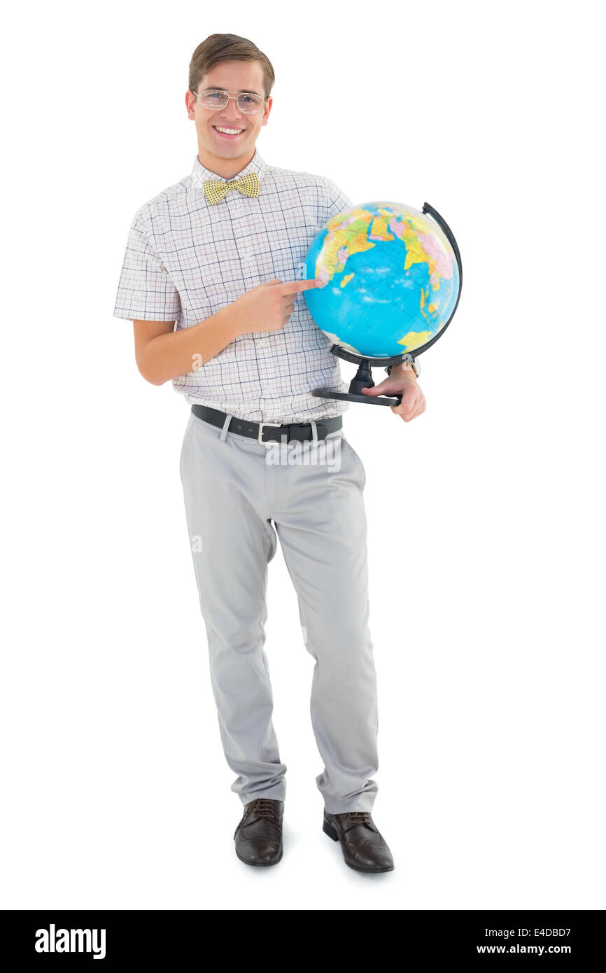 Hipster geek holding a globe smiling at camera Banque D'Images