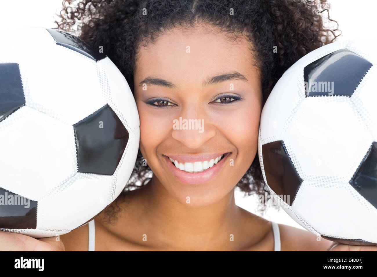 Jolie fille avec coiffure afro ballons holding smiling at camera Banque D'Images