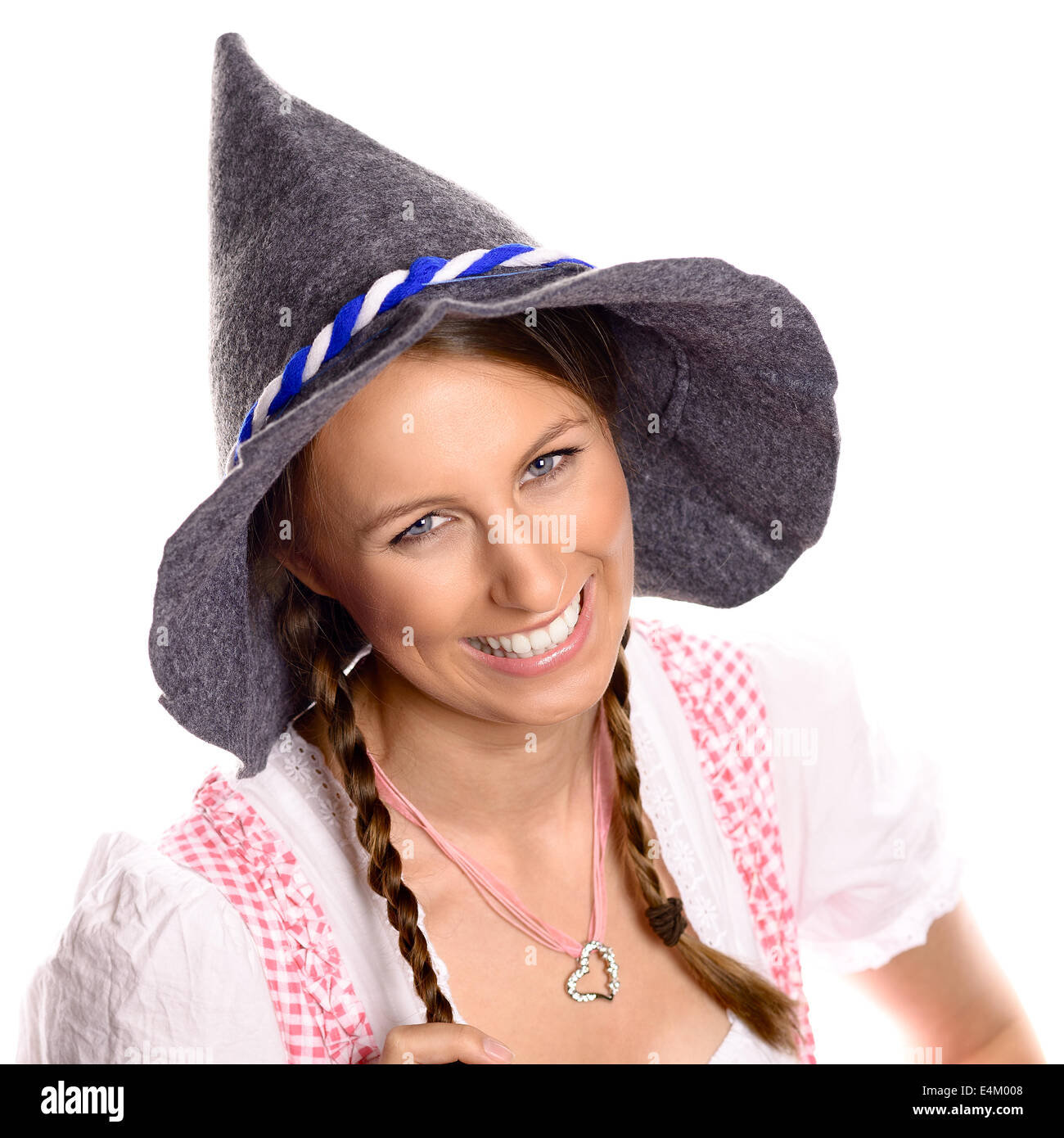 Belle femme dans un allemand traditionnel ou rustique bavarois dirndl et party hat Banque D'Images