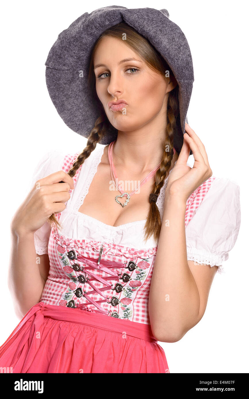 Belle femme dans un allemand traditionnel ou rustique bavarois dirndl et party hat Banque D'Images