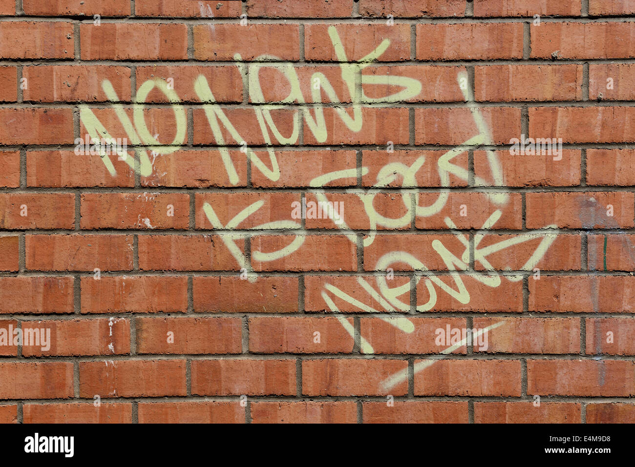 Pas de nouvelles, bonnes nouvelles slogan sur un mur de briques Banque D'Images