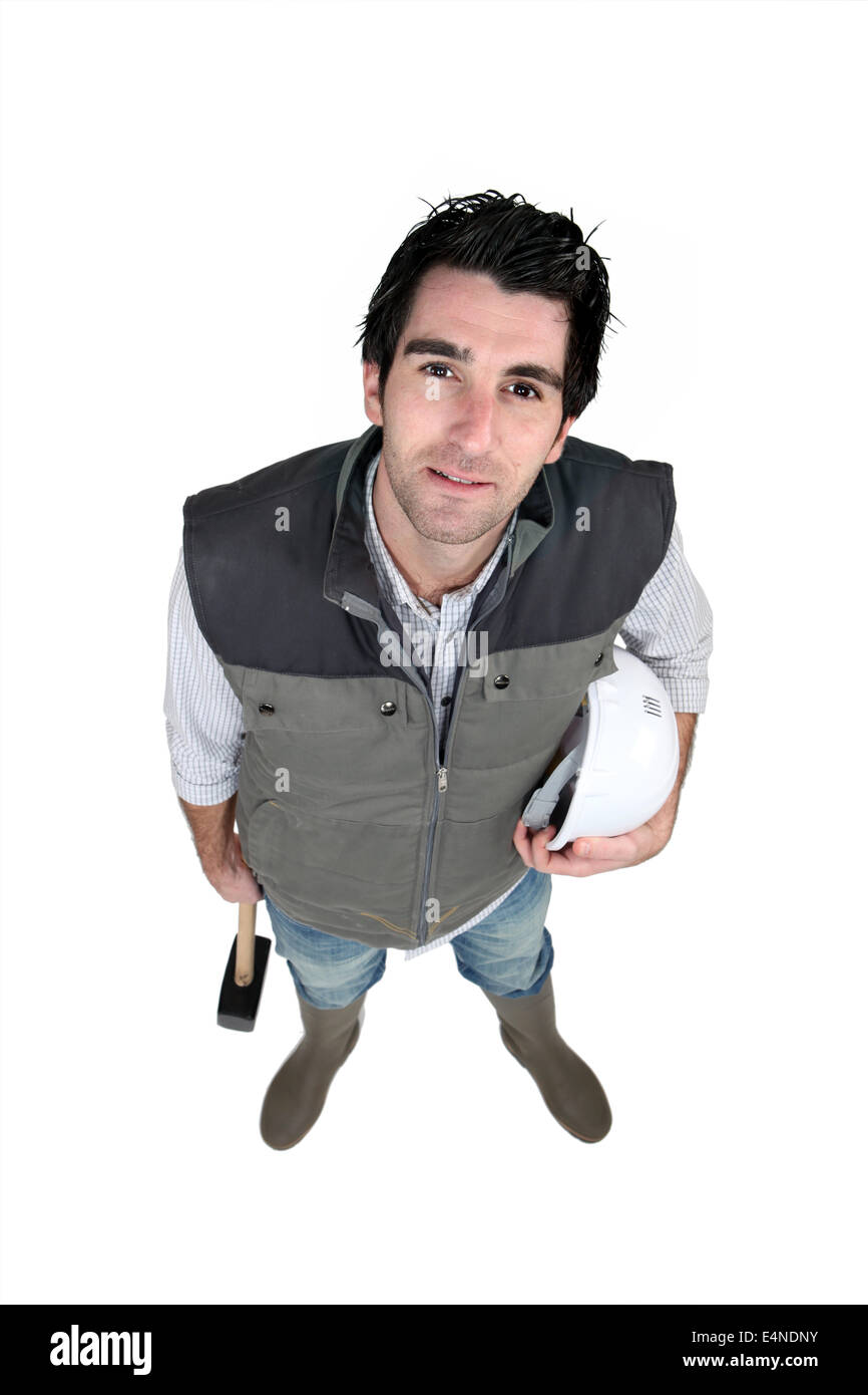 L'homme avec un marteau à la recherche vers le haut Banque D'Images