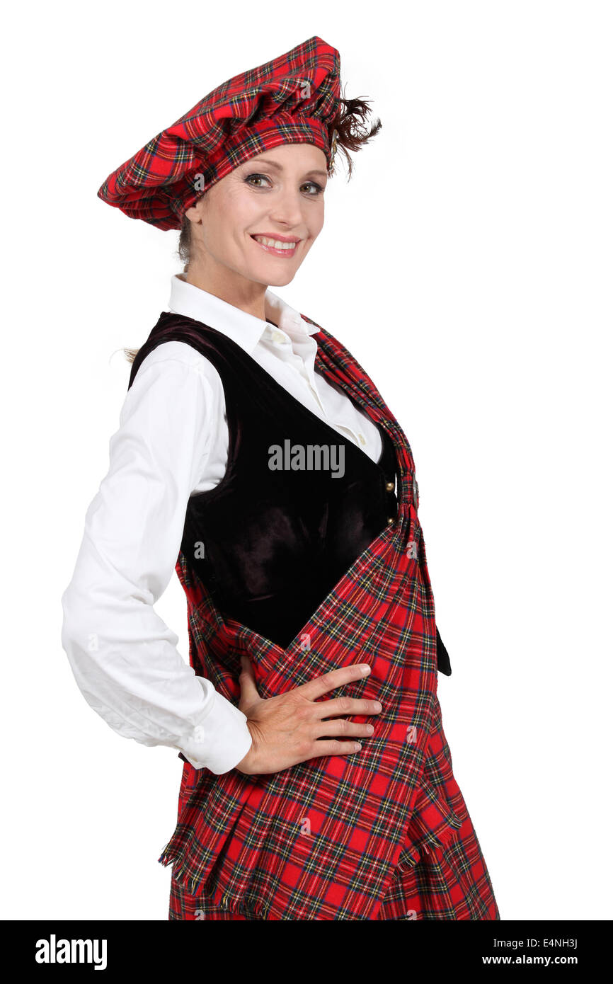 Femme dans un tartan traditionnel outfit Banque D'Images