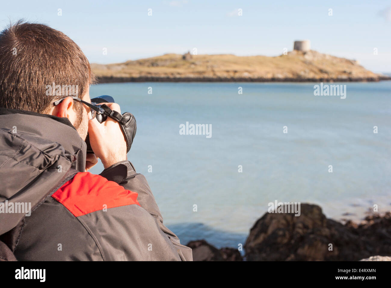 Le jeune photographe dans la côte Banque D'Images