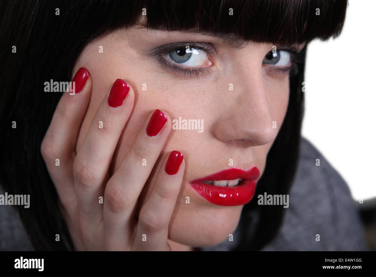 Une femme avec des ongles peints Banque D'Images