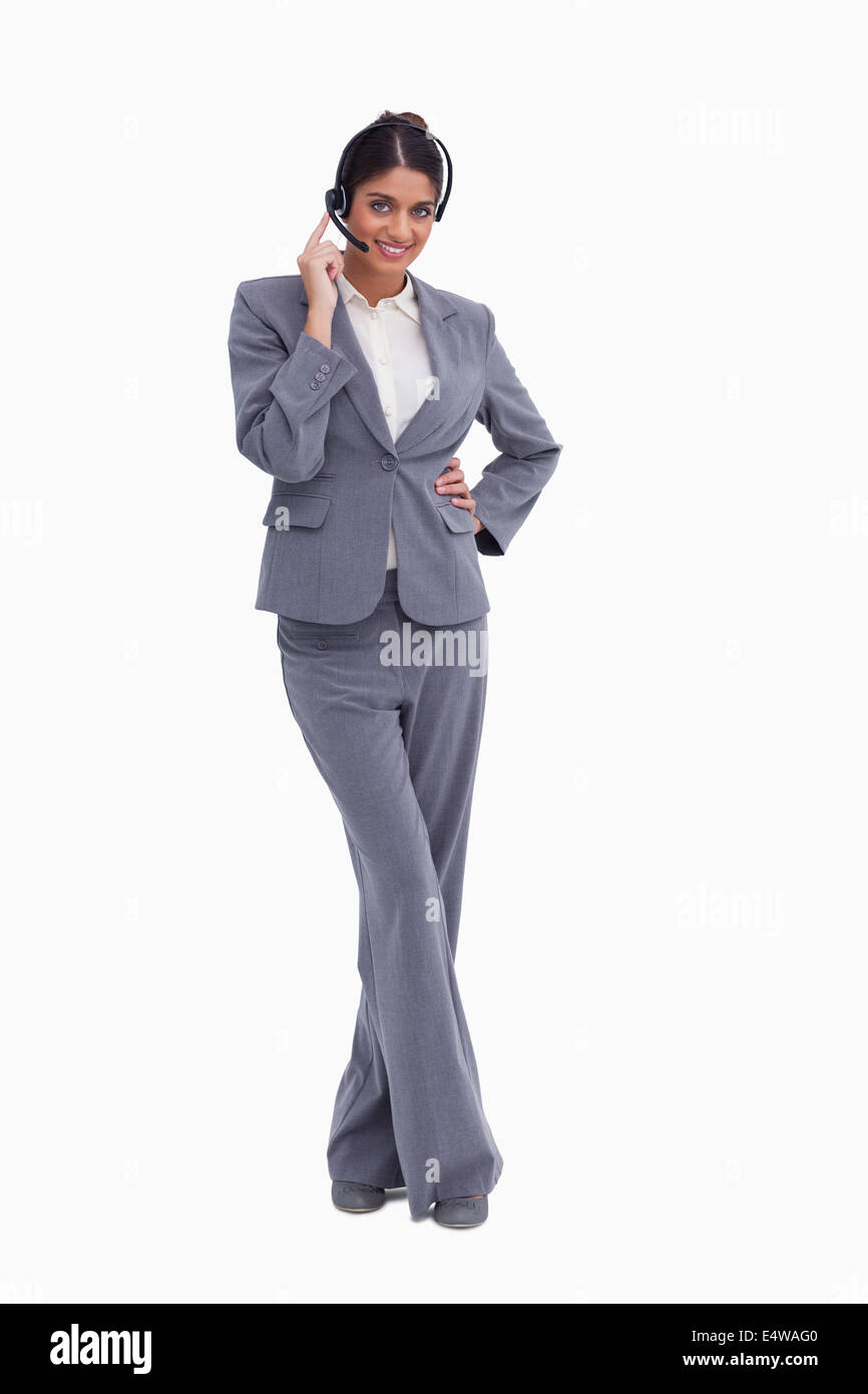 Femme agent de centre d'appels avec jambes croisées Banque D'Images