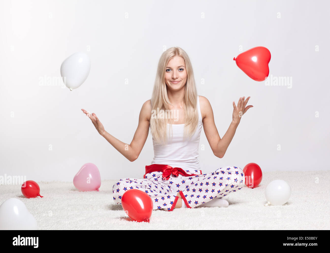 Femme blonde avec des ballons Banque D'Images