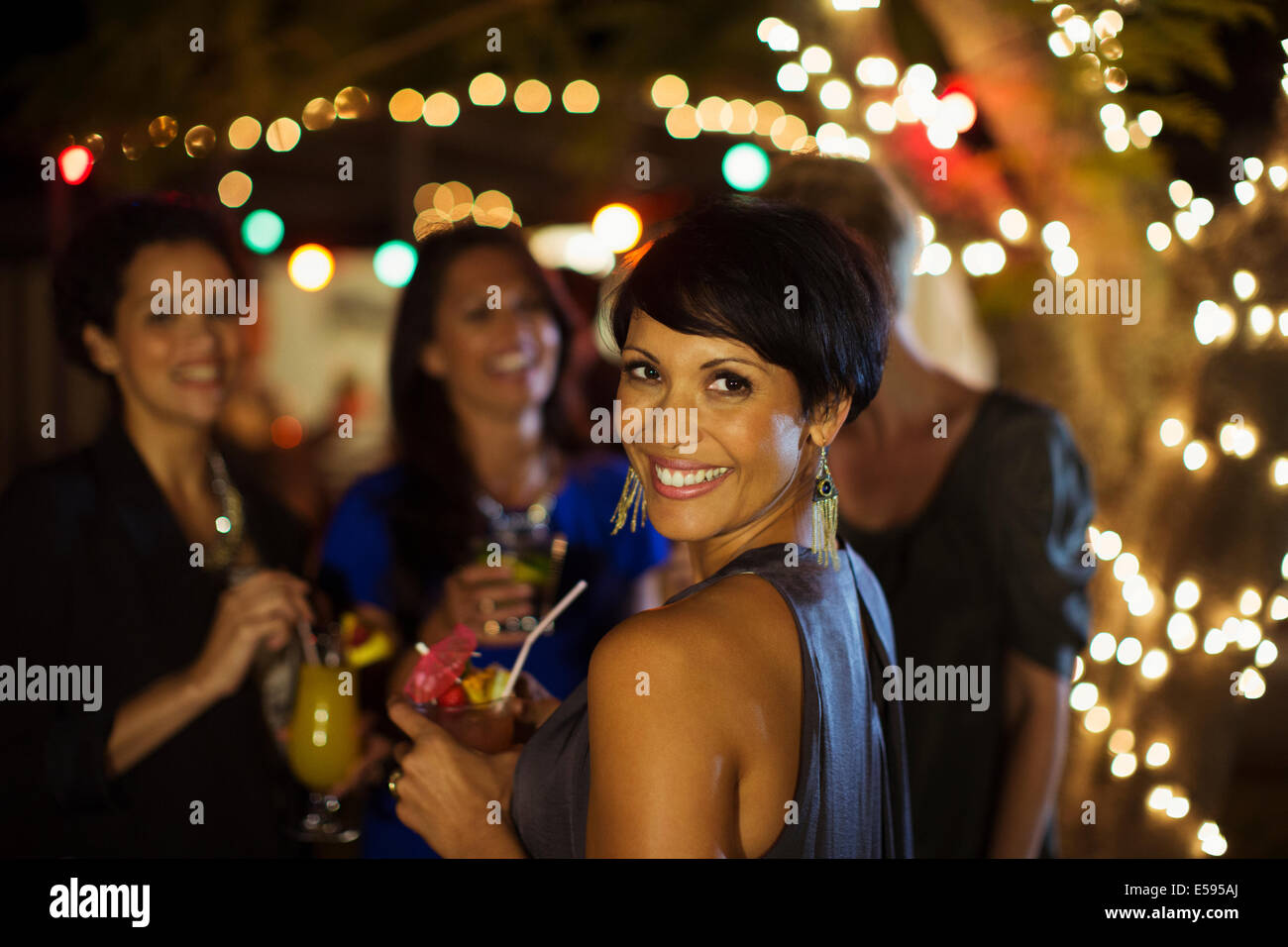Woman smiling at party Banque D'Images