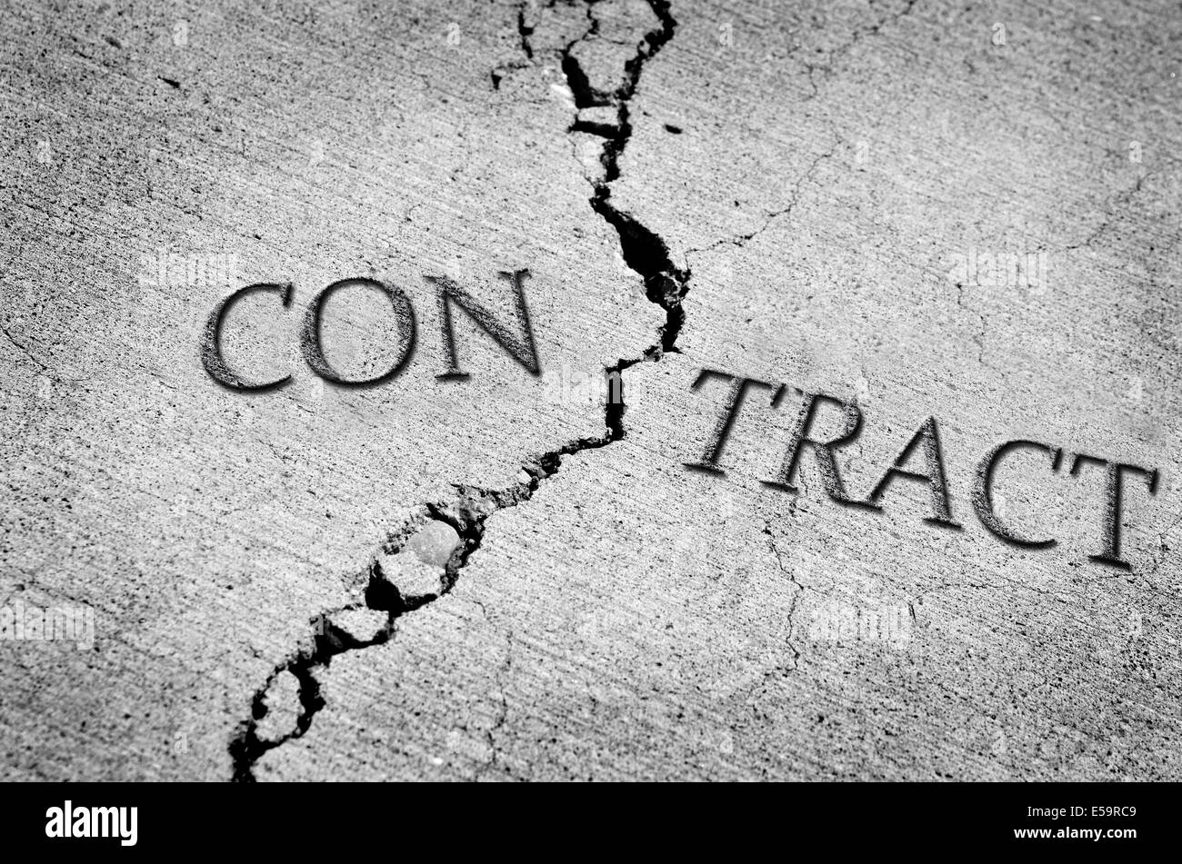 Ciment fissurées ou cassées qui symbolise un contrat rompu Banque D'Images