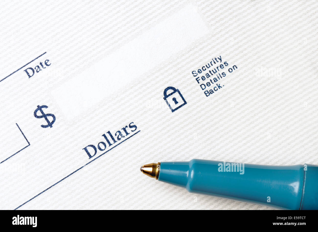 Stylo sur chèque en blanc pour être écrit avec des dollars Banque D'Images