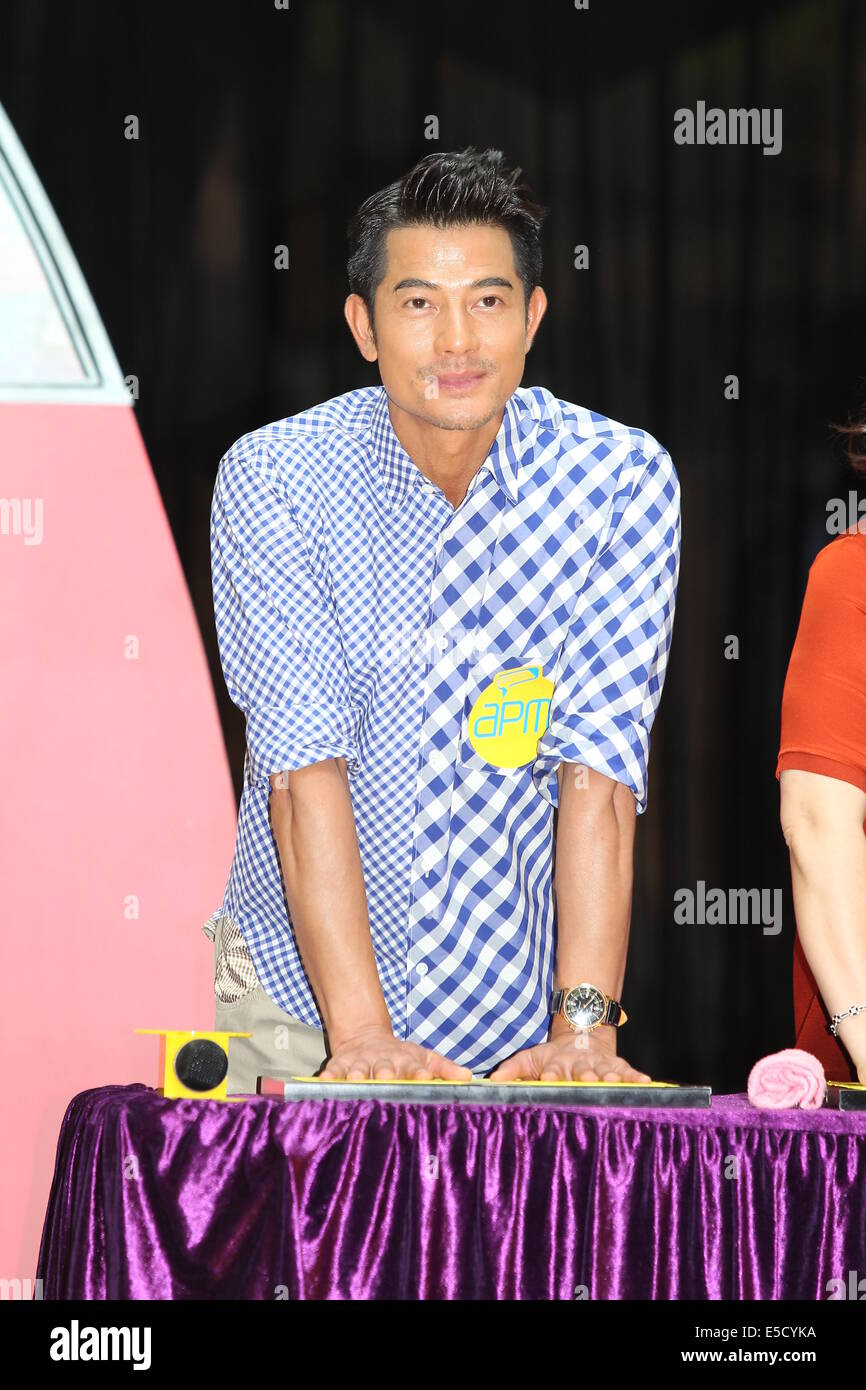 Hong Kong, Chine. 27 juillet, 2014. Chanteur et comédien Aaron Kwok participe à l'activité art Romero Britto à Hong Kong, Chine Le dimanche 27 juillet 2014. © TopPhoto/Alamy Live News Banque D'Images