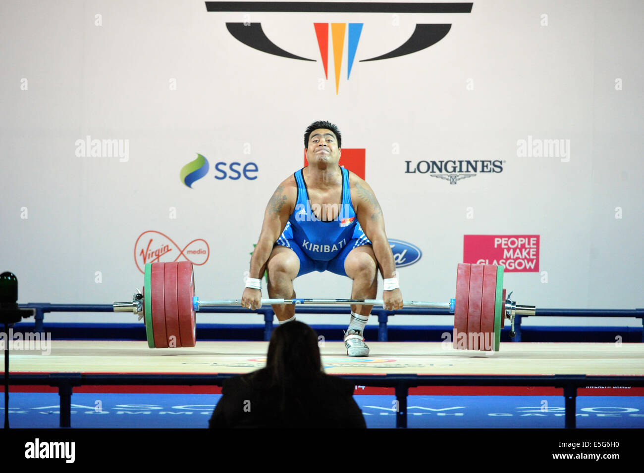 Glasgow, Ecosse, Royaume-Uni. 30 juillet, 2014. David Katoatau (KIR) sentiment la souche qu'il effectue un ascenseur de 200 kg au cours de la XX Jeux du Commonwealth men's 105kg compétition d'haltérophilie. Il a remporté l'or dans la compétition avec un total combiné de levage 348kg. Sa victoire est la première fois que Kiribati n'ont jamais gagné une médaille dans une grande compétition, en tout cas. Crédit : Michael Preston/Alamy Live News Banque D'Images