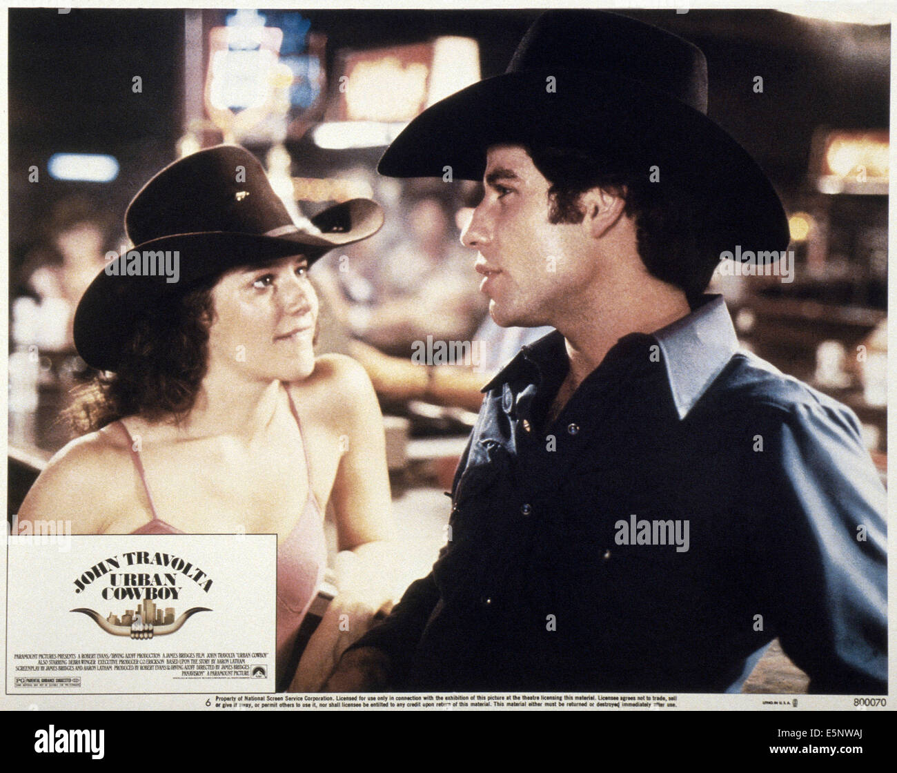 Nous lobbycard, Urban Cowboy, de gauche : Debra Winger, John Travolta, 1980 Banque D'Images