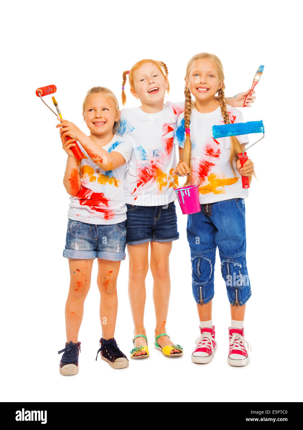 Trois filles souriant avec des brosses Banque D'Images