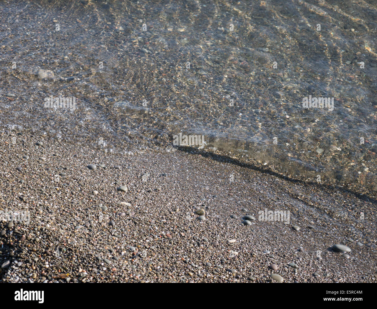 Sable grossier de l'eau claire Banque D'Images