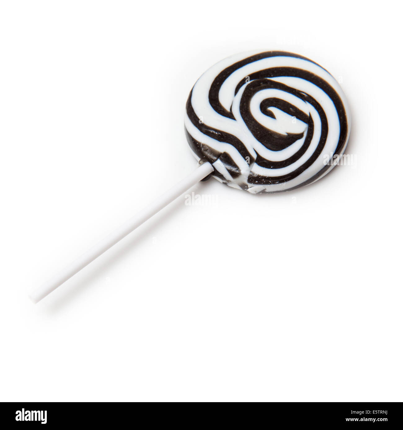 Zebra noir et blanc rayé lollipop isolated on a white background studio. Banque D'Images